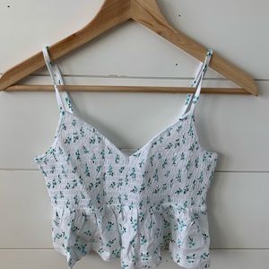 Cute white tank top with a floral print.